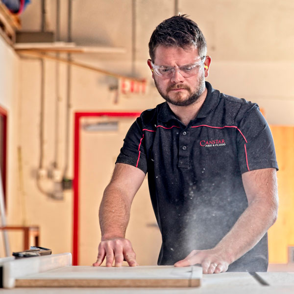 man using table saw
