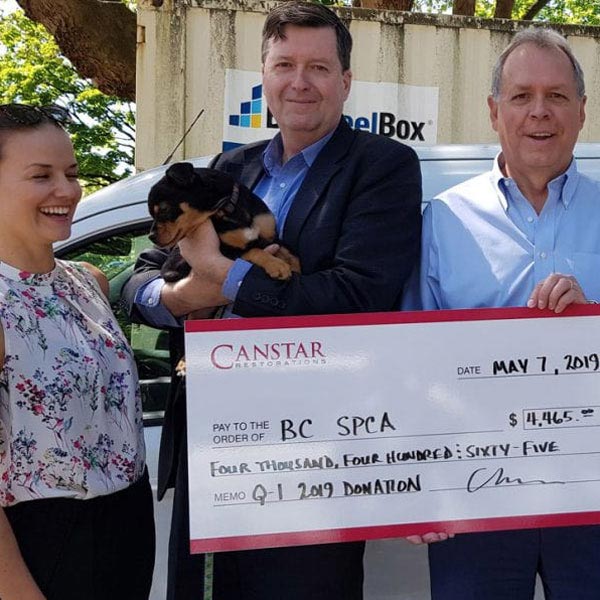 people with giant check